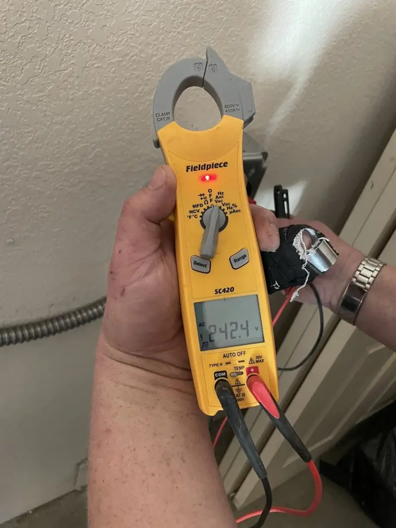 Voltage testing with clamp meter during Electrical Installation Services in Mount Plymouth